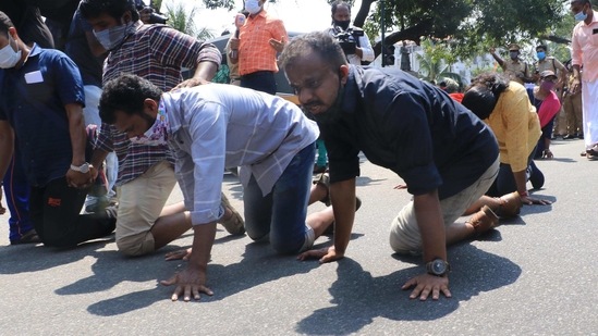 Protesting candidates crawled outside the state secretariat on their knees on Monday and two of them were later hospitalized after they fainted. (HT PHOTO). Protesting candidates crawled outside the state secretariat on their knees on Monday and two of them were later hospitalized after they fainted. (HT PHOTO).