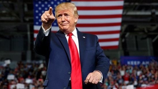 Donald Trump gestures to the crowd as he arrives to speak at a campaign rally. (AP File Photo ) Donald Trump gestures to the crowd as he arrives to speak at a campaign rally. (AP File Photo )