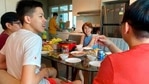 Chan Jit Yen smiles as she hosts Malaysian students.(AP) Chan Jit Yen smiles as she hosts Malaysian students.(AP)