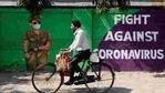 A man cycles past a graffiti covered wall amidst the spread of the coronavirus disease (COVID-19) on a street in Navi Mumbai on January 30. (Francis Mascarenhas / REUTERS) A man cycles past a graffiti covered wall amidst the spread of the coronavirus disease (COVID-19) on a street in Navi Mumbai on January 30. (Francis Mascarenhas / REUTERS)