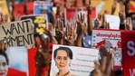 Protesters hold up the three finger salute with signs calling for the release of detained Myanmar civilian leader Aung San Suu Kyi during a demonstration against the military coup in Yangon.(AFP) Protesters hold up the three finger salute with signs calling for the release of detained Myanmar civilian leader Aung San Suu Kyi during a demonstration against the military coup in Yangon.(AFP)