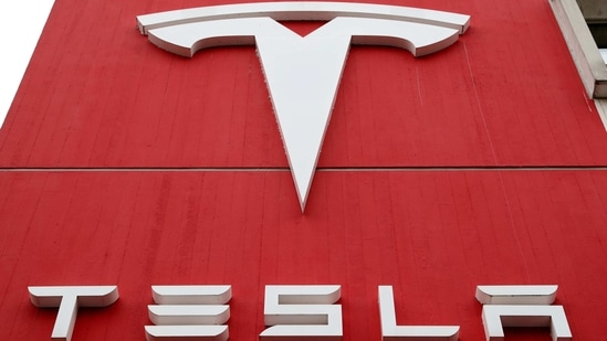 FILE PHOTO: FILE PHOTO: The logo of car manufacturer Tesla is seen at a branch office in Bern, Switzerland October 28, 2020. REUTERS/Arnd Wiegmann/File Photo/File Photo(REUTERS)