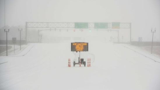 A sign warns motorists after a sudden heavy bout of snow and frozen rain on MS Highway 463 in Madison, north of Jackson, Mississippi, US.(via REUTERS)