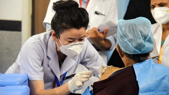 A health worker receives a Covid-19 vaccine shot, at AIIMS in New Delhi on Saturday. (ANI Photo) A health worker receives a Covid-19 vaccine shot, at AIIMS in New Delhi on Saturday. (ANI Photo)
