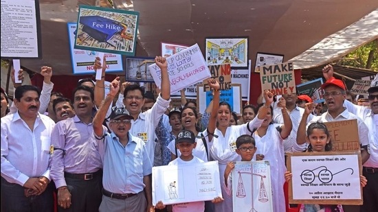 Parents and children take part in a protest against the exorbitant fee hike and collection of huge amount of un-approved and illegal fees by private schools. (HT file Photo) Parents and children take part in a protest against the exorbitant fee hike and collection of huge amount of un-approved and illegal fees by private schools. (HT file Photo)