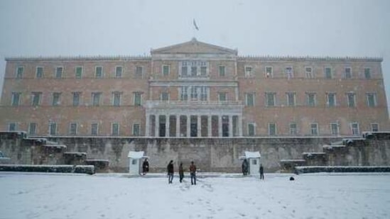 Snow falls in front of the Greek parliament in Athens, Tuesday, Feb. 16, 2021. A cold weather front has hit Greece, sending temperatures plunging from the low 20s Celsius (around 70 Fahrenheit) on Friday to well below freezing on Tuesday, and heavy snowfall in central Athens. (AP Photo/Thanassis Stavrakis) (AP) Snow falls in front of the Greek parliament in Athens, Tuesday, Feb. 16, 2021. A cold weather front has hit Greece, sending temperatures plunging from the low 20s Celsius (around 70 Fahrenheit) on Friday to well below freezing on Tuesday, and heavy snowfall in central Athens. (AP Photo/Thanassis Stavrakis) (AP)