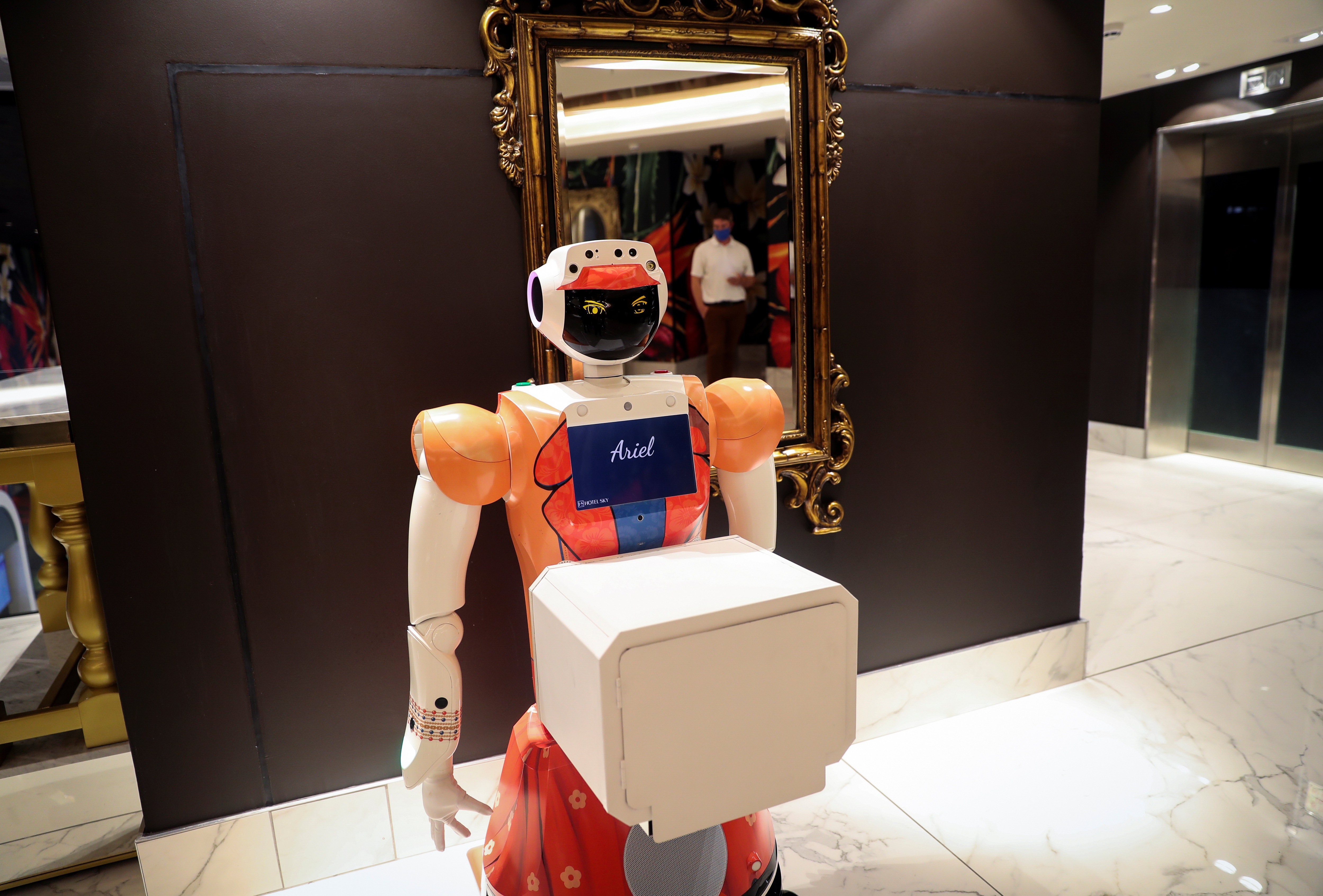 AI-powered robot Ariel waits for room service food to be placed in its box. (REUTERS)