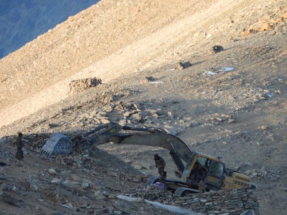 Cranes razing structures and sangars near the bank of the lake. (SOURCED/Indian Army/Rahul Singh) Cranes razing structures and sangars near the bank of the lake. (SOURCED/Indian Army/Rahul Singh)