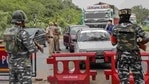 Jammu and Kashmir Police and Central Reserve Police Force (CRPF) personnel check vehicles on the Jammu-Srinagar National Highway in this file photo.(PTI Photo) Jammu and Kashmir Police and Central Reserve Police Force (CRPF) personnel check vehicles on the Jammu-Srinagar National Highway in this file photo.(PTI Photo)