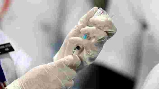 A healthcare worker fills a syringe with a dose of Bharat Biotech's COVID-19 vaccine called COVAXIN. (REUTERS)