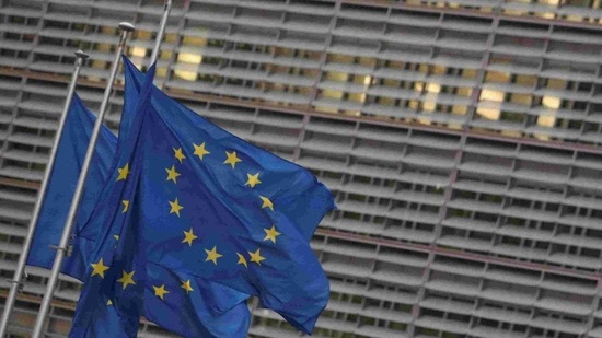 European Union flags flutter outside the European Commission headquarters in Brussels, Belgium.(Reuters)