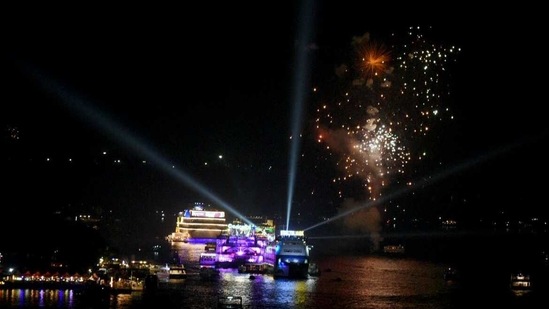 Ferry boats decorated with lights as fireworks welcoming the New Year 2021 on the bank of River Mandovi in Panaji City.(ANI) Ferry boats decorated with lights as fireworks welcoming the New Year 2021 on the bank of River Mandovi in Panaji City.(ANI)