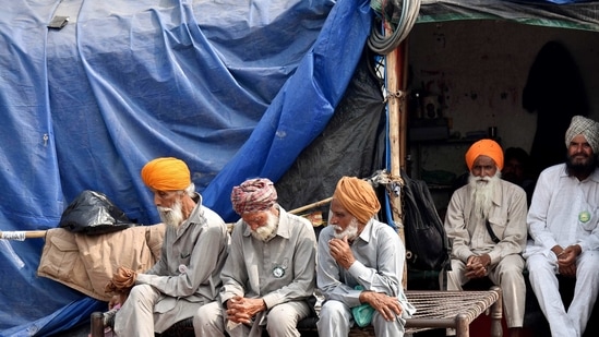 Farmers take rest during their ongoing protest against new farm laws at Singhu border, in Delhi on Tuesday (ANI). Farmers take rest during their ongoing protest against new farm laws at Singhu border, in Delhi on Tuesday (ANI).