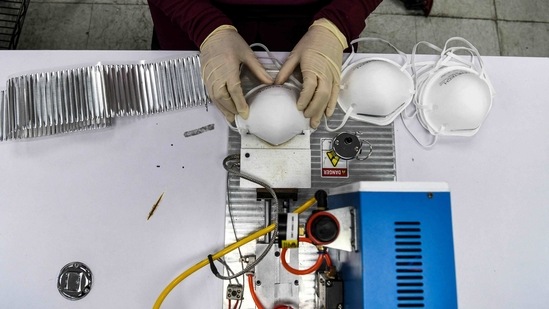 Employees work as they make respiratory masks in a family-owned medical equipment factory in north Miami, Florida. (AP) Employees work as they make respiratory masks in a family-owned medical equipment factory in north Miami, Florida. (AP)