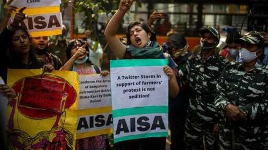 Indian students hold placards and shout slogans condemning police action against various activists during a protest in New Delhi, India, Tuesday, Feb. 16, 2021. Police on Saturday arrested climate activist Disha Ravi, for circulating a document on social media supporting months of massive protests by farmers. Police also issued arrest warrants for two other activists, Nikita Jacob and Shantanu Muluk, saying the three created the document and shared it with others. According to police, the sharing of the document on social media indicated there was a “conspiracy” behind violence on Jan. 26, India's Republic Day, when the largely peaceful farmer protests erupted into clashes with police. (AP Photo/Altaf Qadri) (AP) Indian students hold placards and shout slogans condemning police action against various activists during a protest in New Delhi, India, Tuesday, Feb. 16, 2021. Police on Saturday arrested climate activist Disha Ravi, for circulating a document on social media supporting months of massive protests by farmers. Police also issued arrest warrants for two other activists, Nikita Jacob and Shantanu Muluk, saying the three created the document and shared it with others. According to police, the sharing of the document on social media indicated there was a “conspiracy” behind violence on Jan. 26, India's Republic Day, when the largely peaceful farmer protests erupted into clashes with police. (AP Photo/Altaf Qadri) (AP)