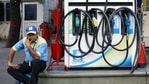A petrol pump attendant waits for customers as national petrol and diesel prices rise at Bharat Petroleum Fuel Station, in New Delhi. (ANI File Photo ) A petrol pump attendant waits for customers as national petrol and diesel prices rise at Bharat Petroleum Fuel Station, in New Delhi. (ANI File Photo )