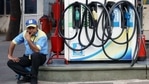 A petrol pump attendant waits for customers as national petrol and diesel prices rise at Bharat Petroleum Fuel Station, in New Delhi on Tuesday.(ANI) A petrol pump attendant waits for customers as national petrol and diesel prices rise at Bharat Petroleum Fuel Station, in New Delhi on Tuesday.(ANI)