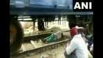 The image shows the woman lying on track as the train passed over her.(Twitter/@ANI) The image shows the woman lying on track as the train passed over her.(Twitter/@ANI)