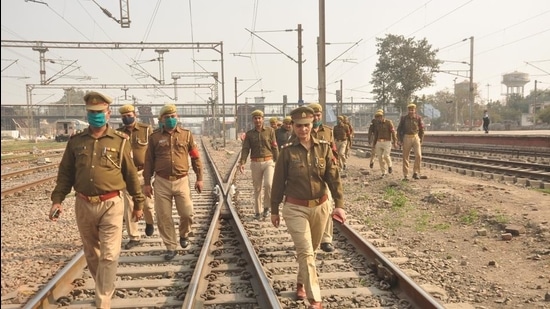 Railway Protection Force (RPF) personnel patrol Ghaziabad Junction ahead of today’s rail roko call by farmers, in Ghaziabad. (Sakib Ali/HT Photo)