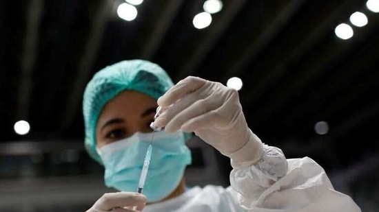 A healthcare worker prepares a dose of Sinovac's vaccine for the coronavirus disease (COVID-19) during a mass vaccination for medical workers at the Istora Senayan stadium in Jakarta, Indonesia, February 4, 2021. REUTERS/Willy Kurniawan (REUTERS)