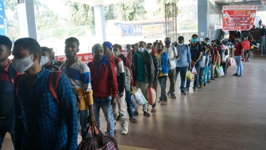 Passengers stand in a queue to board the train amid farmers' Country-Wide Rail Roko Protest at Bhubaneswar railway station, in Bhubaneswar on Thursday. (ANI Photo)