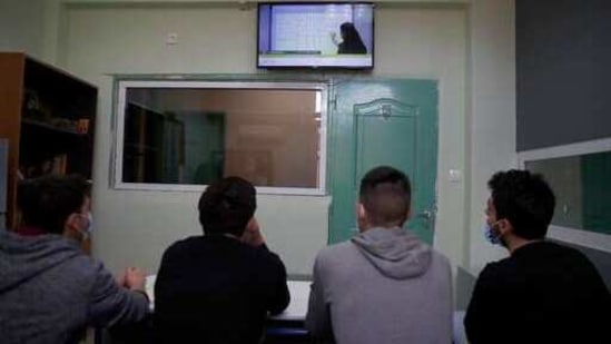 Inmates watch mathematics on "Prospathodas TV," or "Trying TV," the channel of Avlona's prison school, north of Athens. (AP) Inmates watch mathematics on "Prospathodas TV," or "Trying TV," the channel of Avlona's prison school, north of Athens. (AP)