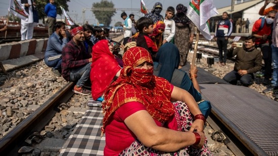 Demonstrators blocking railway tracks as part of protests against new farm laws, in Sonipat on February 18. The announcement of the “rail roko” last week came amid the ongoing protests against the laws at Delhi's borders and 'mahapanchayats' that are being organised in Punjab, Haryana and Uttar Pradesh to garner support for the movement.(Danish Siddiqui / REUTERS)