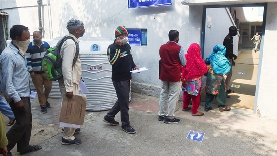 Sanitation workers stand in a queue to receive the first dose of Covaxin vaccine, at Hindu Rao Hospital in New Delhi on Tuesday (PTI Photo) Sanitation workers stand in a queue to receive the first dose of Covaxin vaccine, at Hindu Rao Hospital in New Delhi on Tuesday (PTI Photo)