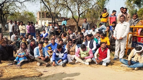 Locals stage a protest after bodies of two minor Dalit girls were found in a field and another in critical condition, near Baburaha village in Unnao district,(PTI)