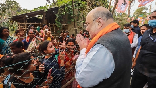 Union home minister Amit Shah interacts with people at Narayanpur village in South 24 Paraganas, (PTI) Union home minister Amit Shah interacts with people at Narayanpur village in South 24 Paraganas, (PTI)