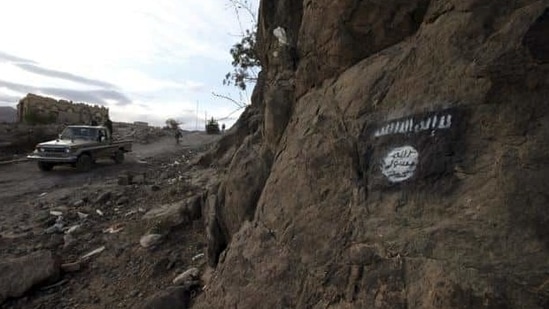 Shi'ite Houthi rebels drive a patrol truck past an Ansar al-Sharia flag painted on the side of a hill, along a road in Almnash, the main stronghold of Ansar al-Sharia, the local wing of Al Qaeda in the Arabian Peninsula (AQAP) in Rada, Yemen. (REUTERS) Shi'ite Houthi rebels drive a patrol truck past an Ansar al-Sharia flag painted on the side of a hill, along a road in Almnash, the main stronghold of Ansar al-Sharia, the local wing of Al Qaeda in the Arabian Peninsula (AQAP) in Rada, Yemen. (REUTERS)