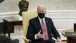 US President Joe Biden wears a protective mask while speaking during a meeting in the Oval Office of the White House in Washington, DC, US.(Bloomberg) US President Joe Biden wears a protective mask while speaking during a meeting in the Oval Office of the White House in Washington, DC, US.(Bloomberg)
