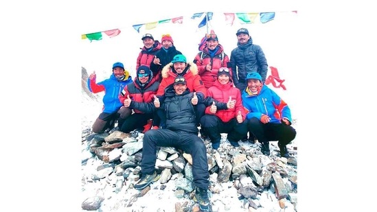Nepalese mountaineers posing for pictures after reaching the summit of Mt K2 on January 16.(Seven Summit Treks / AFP)