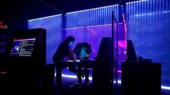 People explore Omega Mart, an immersive art installation by arts production company Meow Wolf, Thursday, Feb. 18, 2021, in Las Vegas. (AP)