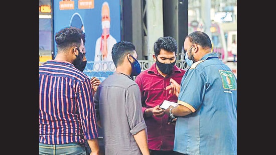 BMC officials fine citizens for violating Covid-19 norms at CSMT on Friday. (Bhushan Koyande/ HT) BMC officials fine citizens for violating Covid-19 norms at CSMT on Friday. (Bhushan Koyande/ HT)