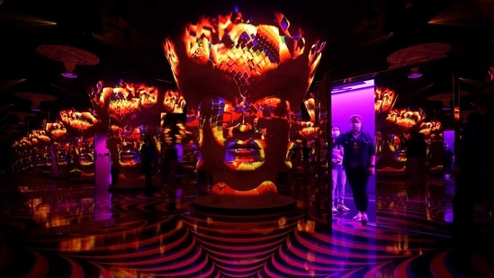 People walk into an infinity room exhibit at Omega Mart, an immersive art installation by arts production company Meow Wolf, Thursday, Feb. 18, 2021, in Las Vegas. (AP)