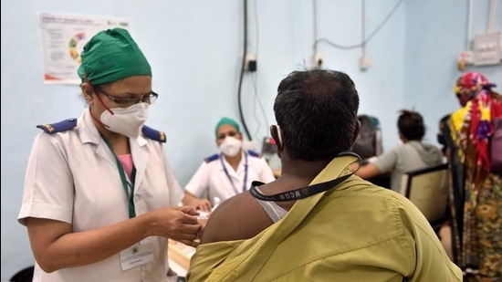 Starting the third phase will be an uphill task for the civic body as only 35% of the total 400,000 registered healthcare workers (HCWs) and frontline workers have been inoculated so far. (HT File)