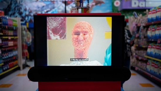 A screen shows a head made from ground beef at Omega Mart, an immersive art installation by arts production company Meow Wolf, Thursday, Feb. 18, 2021, in Las Vegas.(AP)