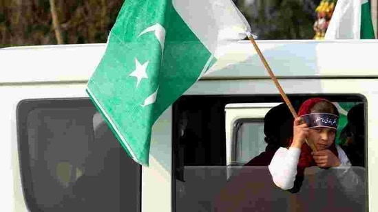 A girl holds a Pakistani flag during a rally.(Reuters) A girl holds a Pakistani flag during a rally.(Reuters)