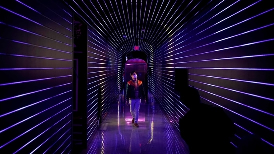 Corvas Brinkerhoff, co-founder of Meow Wolf and creative director of Omega Mart, walks through Omega Mart, an immersive art installation by arts production company Meow Wolf, Thursday, Feb. 18, 2021, in Las Vegas.(AP)