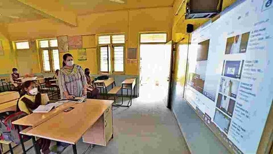 Students of Government Senior Secondary School, Ayali Khurd village attending smart class as school reopens after hiatus of seven months amid precautions.(Gurpreet Singh/HT)