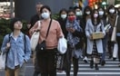 People wear face masks to help curb the spread of the coronavirus in Taipei, Taiwan. (AP Photo) People wear face masks to help curb the spread of the coronavirus in Taipei, Taiwan. (AP Photo)