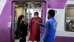 A municipal worker gives a commuter a penalty for not using a face mask at Chhatrapati Shivaji Maharaj Terminus in Mumbai.(AP) A municipal worker gives a commuter a penalty for not using a face mask at Chhatrapati Shivaji Maharaj Terminus in Mumbai.(AP)