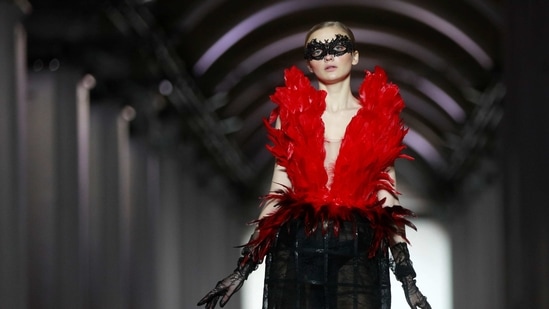 A model presents a creation by Lviv Fashion School clothing design graduates during Ukrainian Fashion Week in Kyiv, Ukraine February 7, 2021.  (REUTERS)