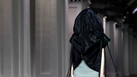 A model presents a creation by designer Irina Dzhus during Ukrainian Fashion Week in Kyiv, Ukraine February 7, 2021. (REUTERS)