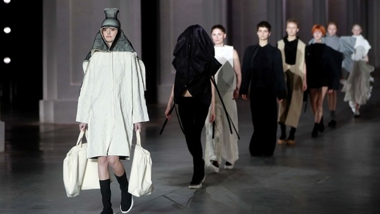 Models present creations by designer Irina Dzhus during Ukrainian Fashion Week in Kyiv, Ukraine February 7, 2021.  (REUTERS)