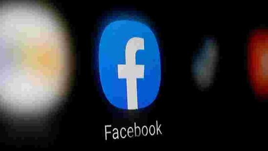 A Facebook logo is displayed on a smartphone. (Reuters)