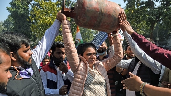 Indian youth Congress members protest against the hike in prices of petrol, diesel and LPG cylinders outside Shastri Bhawan, in New Delhi on Saturday. (ANI Photo)