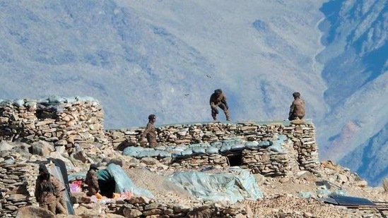 This photograph provided by the Indian Army, according to them shows Chinese troops dismantling their bunkers at Pangong Tso region in Ladakh. (AP) This photograph provided by the Indian Army, according to them shows Chinese troops dismantling their bunkers at Pangong Tso region in Ladakh. (AP)