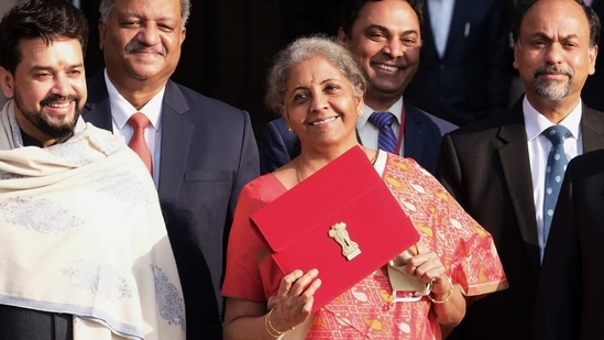 Nirmala Sitharaman, India's finance minister and other members of the finance ministry leave the North Block of the Central Secretariat building in New Delhi, India.(Bloomberg)